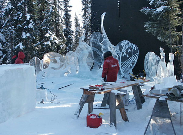 Artists working on ice sculpture “Spring,” during the day.