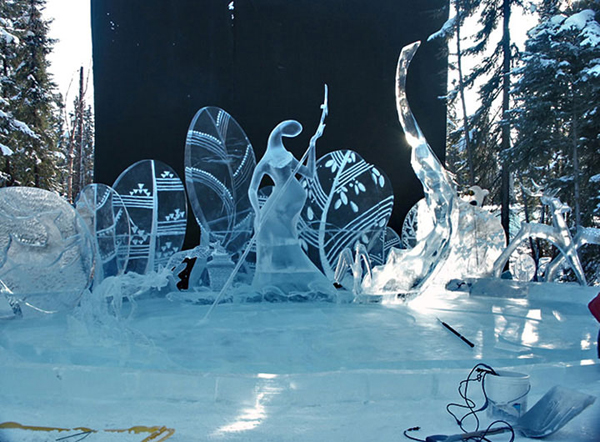 Artists working on ice sculpture “Spring,” during the day.