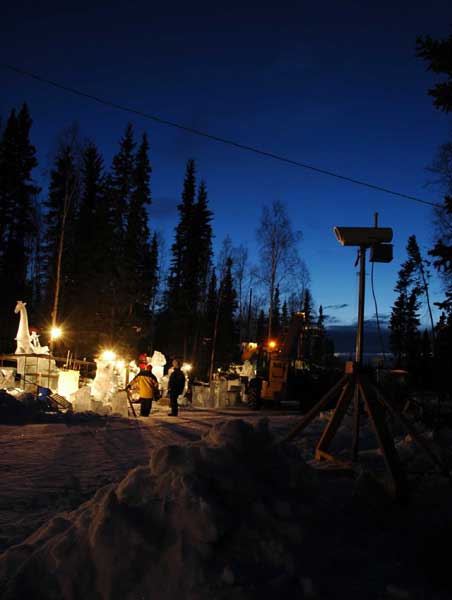 Animal Parade ice sculpture. “Site 5” at night. At the edge of the woods, working at night. By Steve Brice, Heather Brown, Tjana Raukar, and Mario Amegee. Ice Alaska 2005.