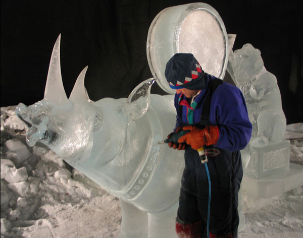 Animal Parade ice sculpture. Steve Brice works on rhino collar. Ice Alaska 2005.