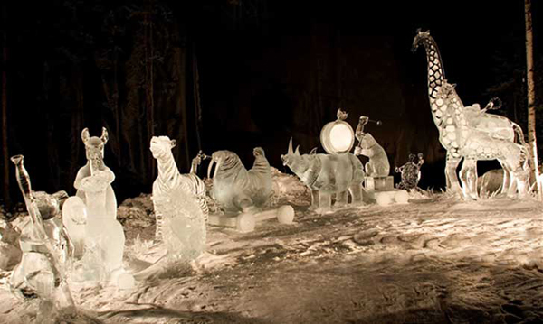 Animal Parade ice sculpture, final judging under white lights, at night. By Steve Brice, Heather Brown, Tjana Raukar, and Mario Amegee. Ice Alaska 2005.