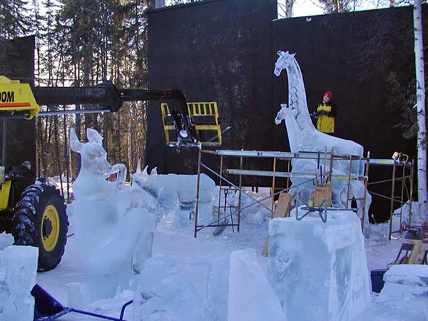 Animal Parade in progress. Scaffolding, crane, etc. in daylight. By Steve Brice, Heather Brown, Tjana Raukar, and Mario Amegee. Ice Alaska 2005