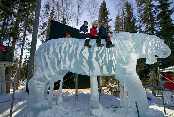 Brice and Brown ice sculpture_"A Rabbit’s View” Artists astride the tiger.