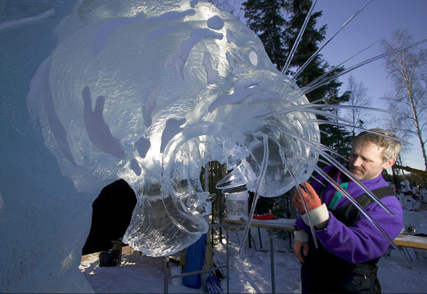 Brice and Brown ice tiger sculpture_"A Rabbit’s View” Steve Brice pictured, sculpting the whiskers.