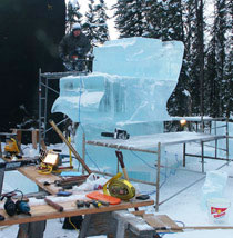 Ice sculptor at work on "Sunrise Over Spring Water.” Ice Alaska event 2007.