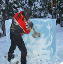Starting sculpture "Ulu" for Ice Alaska's World Ice Art Championships 2007. Abstract sculpture, shows artists using tool.
