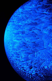 Aaron Costic “Blue Planet,” sphere purposefully cracked by a halogen light to create interesting crackled structure to the ice. Photo by Aaron Costic.