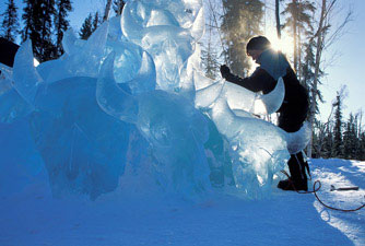 "Wascana" ice sculpture of pile of buffalo skulls carved out of ice. “Wascana” is Cree for “pile of bones.” Patricia Leguen artist, Patrick J. Endres photographer, Ice Alaska event.