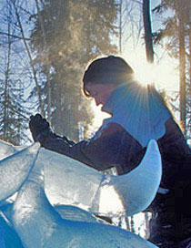 Patricia Leguen carving “Wascana” ice sculpture of a pile of about 48 ice buffalo skulls. For Ice Alaska event 1996, photo by Patrick J. Endres, of AlaskaPhotoGraphics.