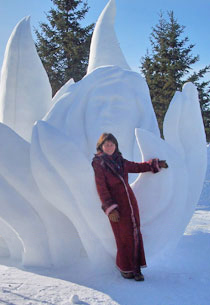 Patricia Leguen stands next to her snow sculpture “Nature’s Beauty” for Winnipeeg Snow Symposium, 2007.