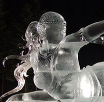 Junichi Nakamura’s “Birth of Blue Bird,” Multi-block ice sculpture of woman lying on her side holding a bird.