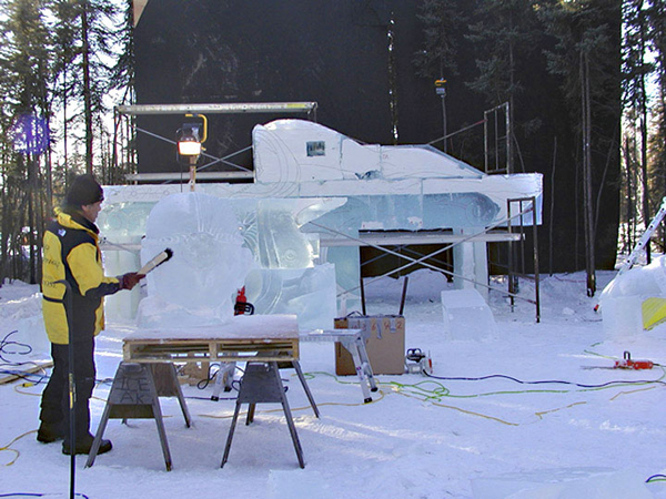 “Birth of Blue Bird,” by Junichi Nakamura and his team for Ice Alaska’s World Ice Art Championships. Work in progress. Artist working, brushing off ice, daytime.