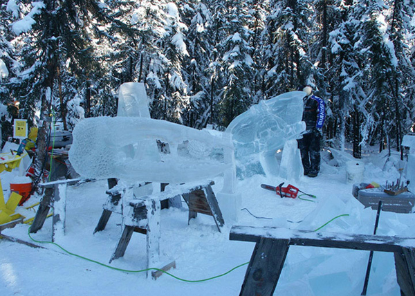 “Beach Walker,” crab ice sculpture in progress, artists working. By Junichi Nakamura and Steve Brice for Ice Alaska’s World Ice Art Championships.