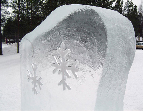 “Kai Tormikoski and Mauno Akhkisalo's sculpture "Four Seasons" 4 ice panels with simple elements of weather carved into them, representing the seasons. Kalajoki, Finland 2004. Detail of one panel, showing snowflake and textures created by buffing tool.