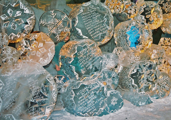 “Snowflake Wall” Ice project by Max Bollkman Zuleta and Jeanne Marie Koivunen-Zuleta. Bruges, Belgium 2000. This detail shows artists’ names carved into spheres with snowflake art.