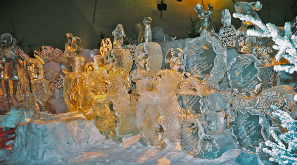 “Snowflake Wall” ice project by Max Bollkman Zuleta and Jeanne Marie Koivunen-Zuleta. Bruges, Belgium 2000. Shows artists’ names carved into spheres with snowflake art.